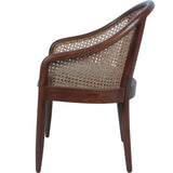 Side view of oak armchair with woven cane backrest.