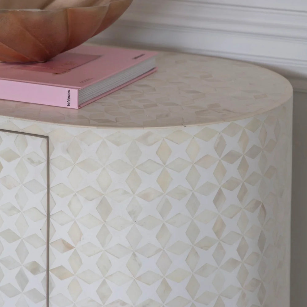 Cream bone inlay sideboard with geometric pattern and decorative bowl on top.