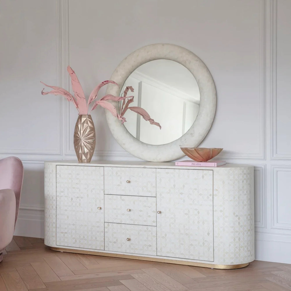 Elegant sideboard with bone inlay pattern in a stylish living room setting.