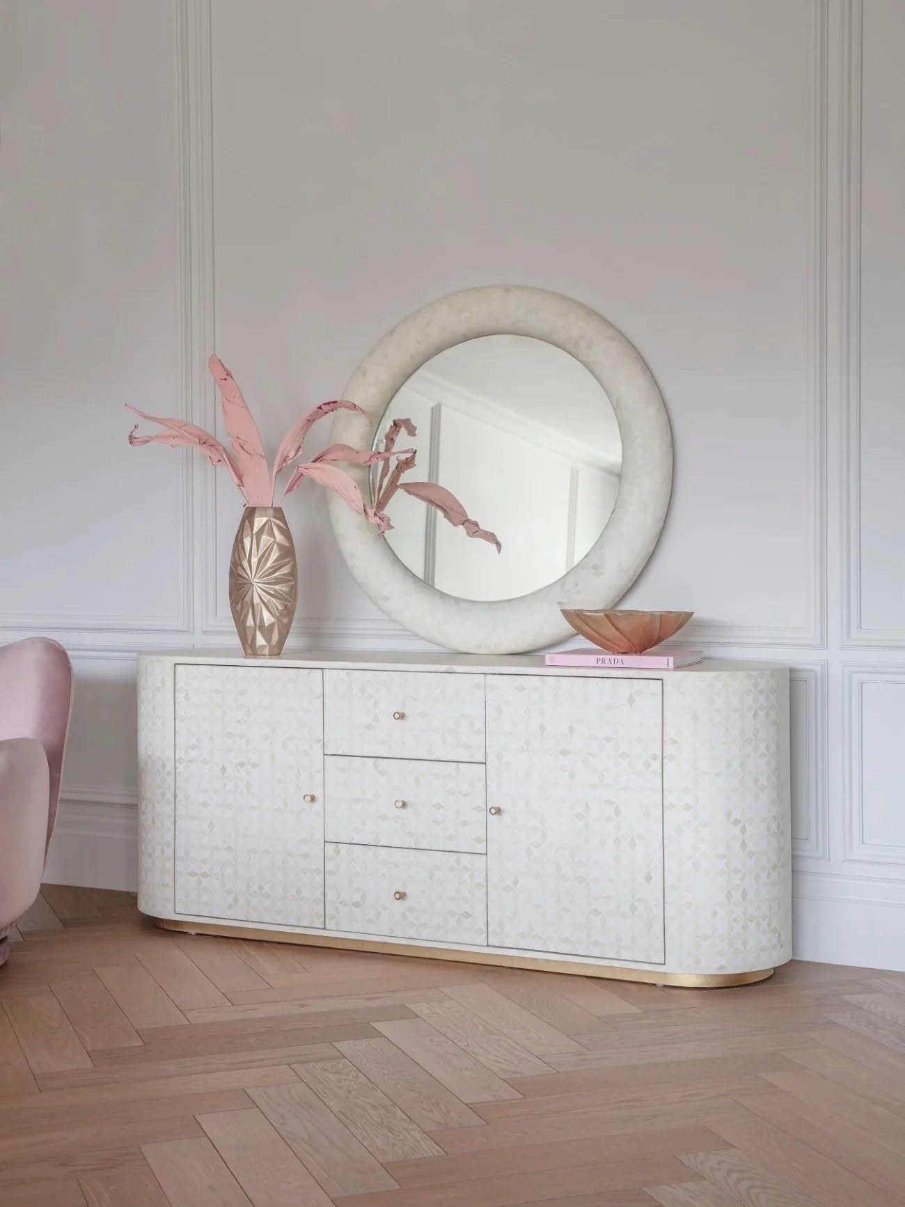 Elegant sideboard with bone inlay pattern in a stylish living room setting.