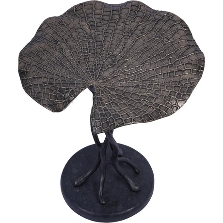 Bronze leaf-shaped table with textured surface and branch-like base.