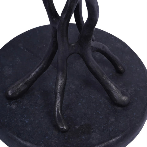 Black cast aluminium table base with organic branch-like design.