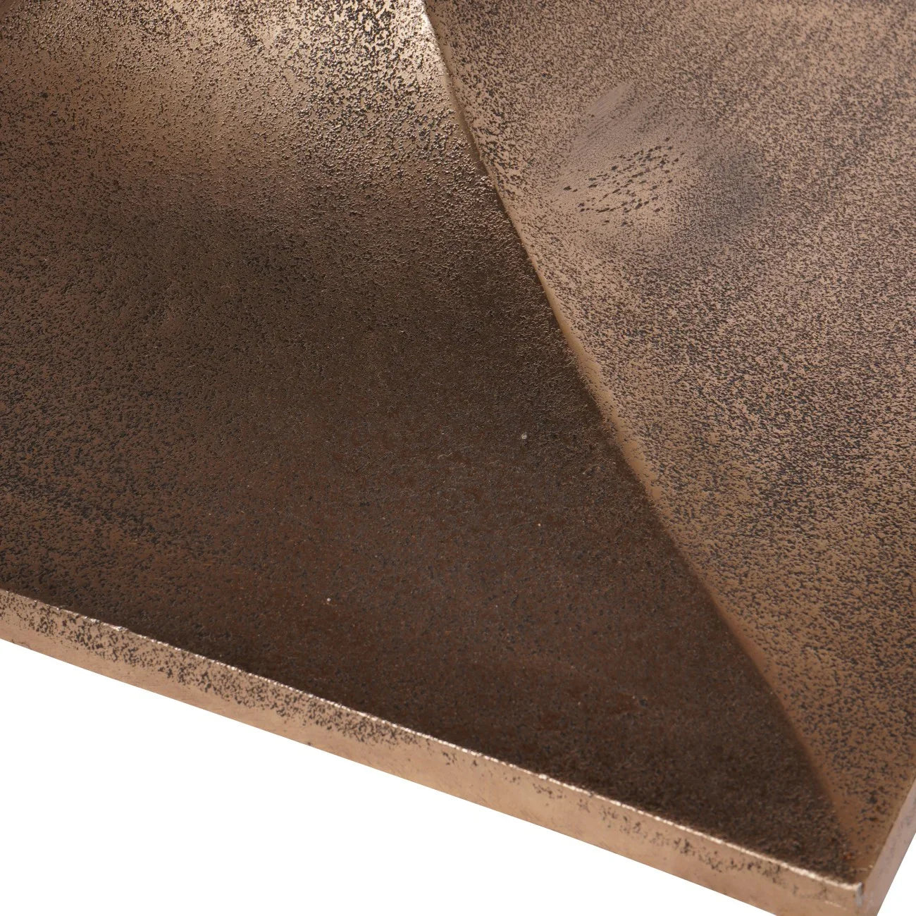 Bronze textured surface with subtle speckled pattern on table base.