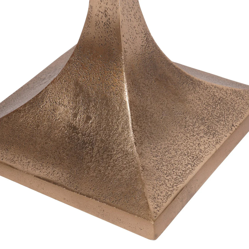 Bronze textured base of a side table with a smooth finish.