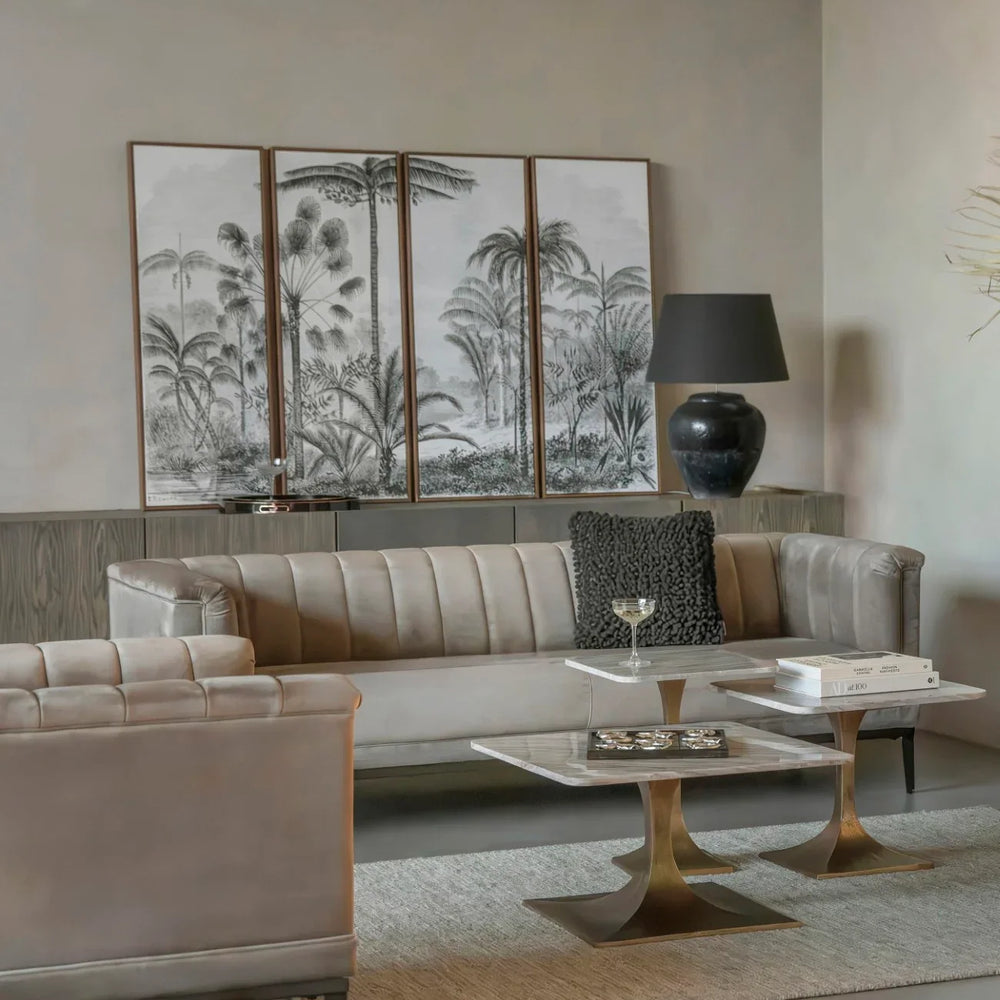 Marble side table in elegant living room with beige sofas and decorative panel art.