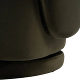Dark green velvet chair base with smooth texture detail.