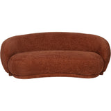 Terracotta curved sofa with textured fabric and plush cushions.