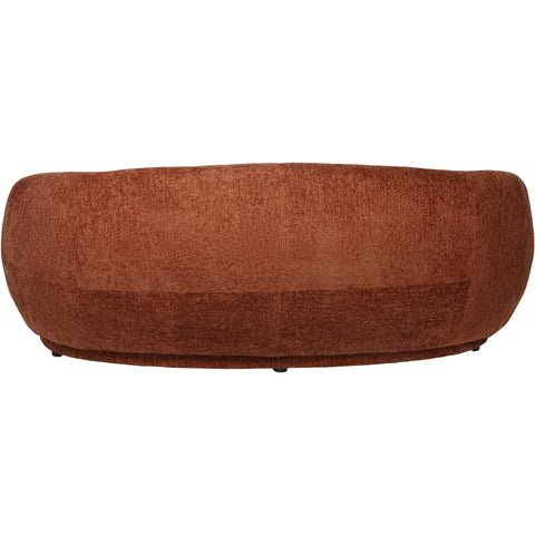 Terracotta curved sofa back view with textured fabric finish.