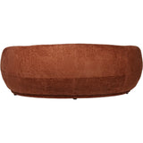Terracotta curved sofa back view with textured fabric finish.