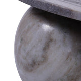 Close-up of marble coffee table leg with smooth, natural stone texture.