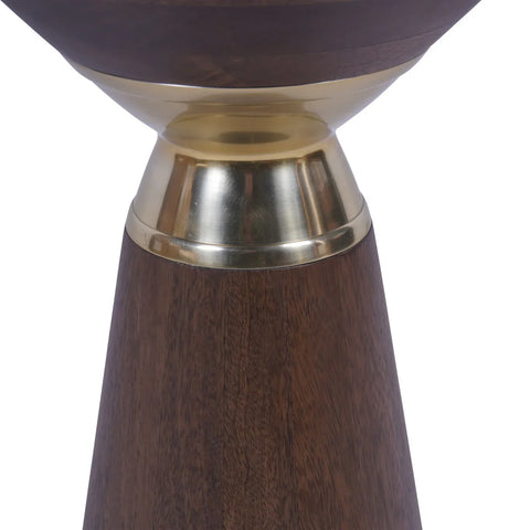 Dark wood table base with a brass accent detail.