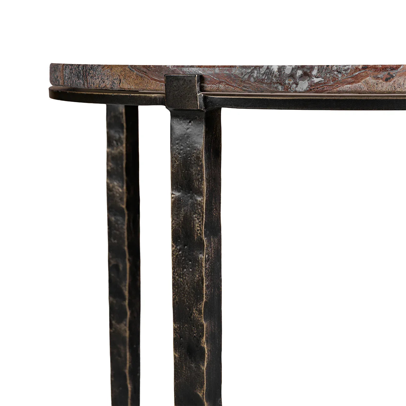 Textured metal legs supporting a round brown marble tabletop.