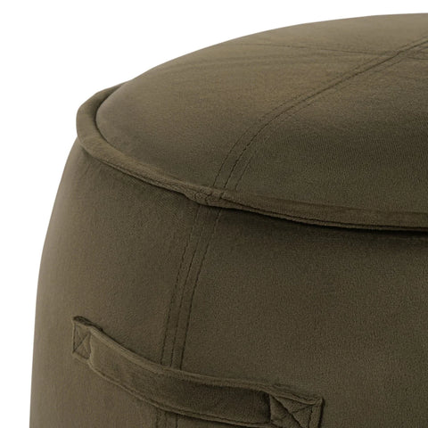 Close-up of green velvet stool with visible stitching detail.