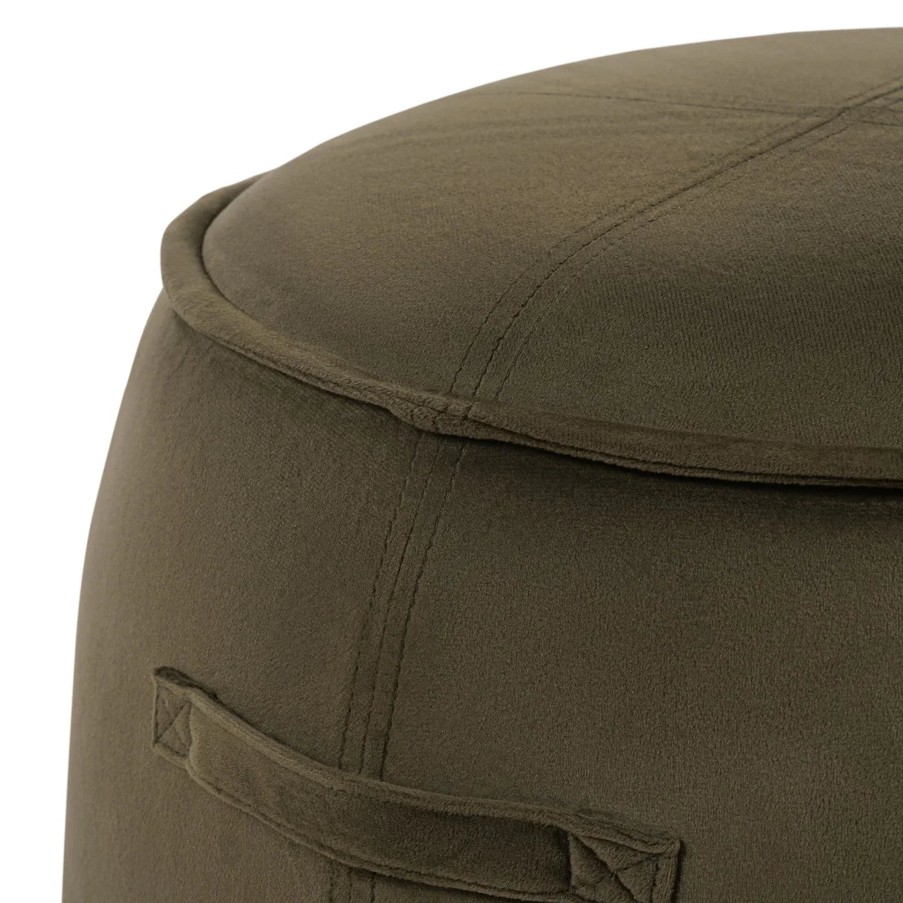 Close-up of green velvet stool with visible stitching detail.