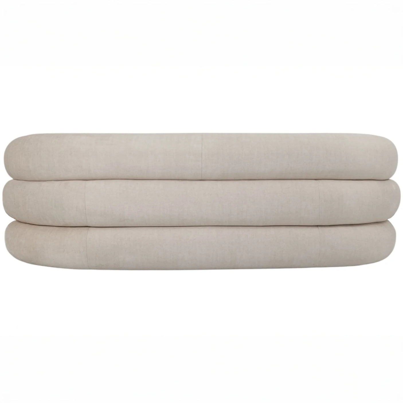 Cream sofa backrest with rounded, layered cushions.