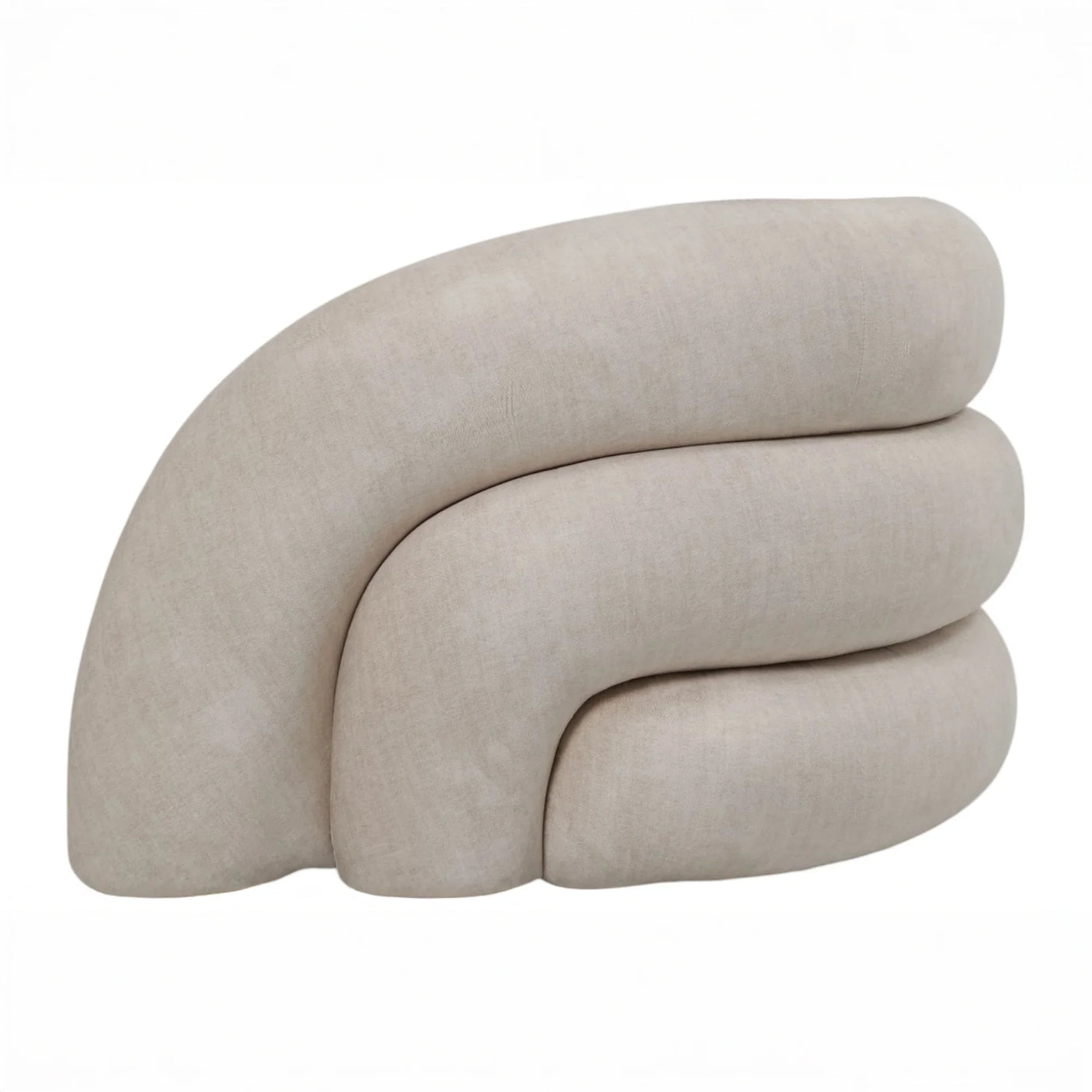 Cream sofa with curved, layered backrest design.