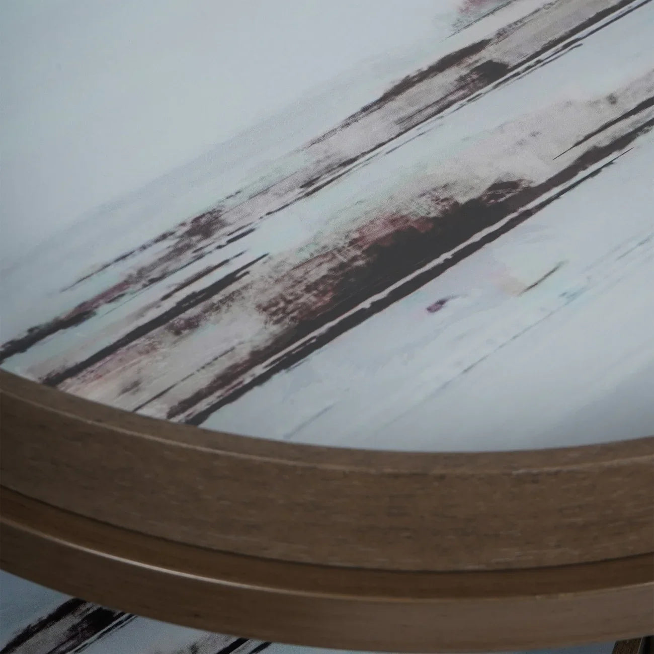 Blurred abstract pattern on round tray table with wood edge.