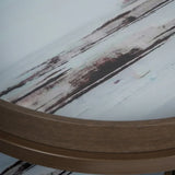 Blurred abstract pattern on round tray table with wood edge.