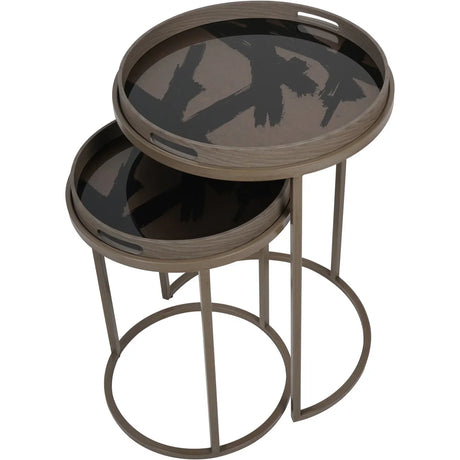 Taupe round tray tables with abstract black brushstroke design.