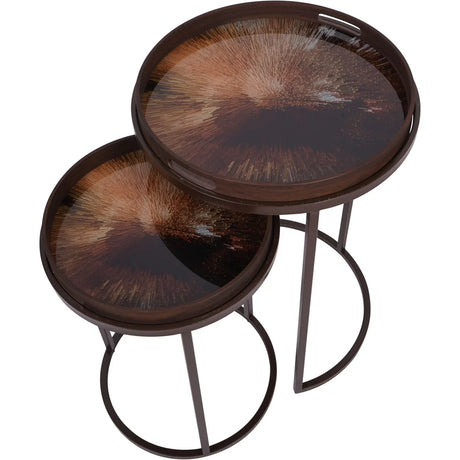 Round brown tray tables with burst pattern tops, nested together.