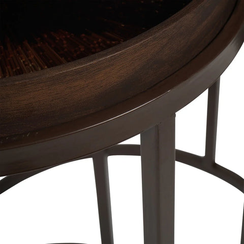 Dark wooden table edge with intricate burst design detail