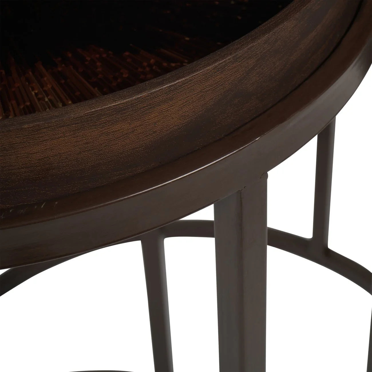 Dark wooden table edge with intricate burst design detail