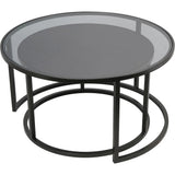 Black metal nesting tables with glass tops, one tucked under the other.