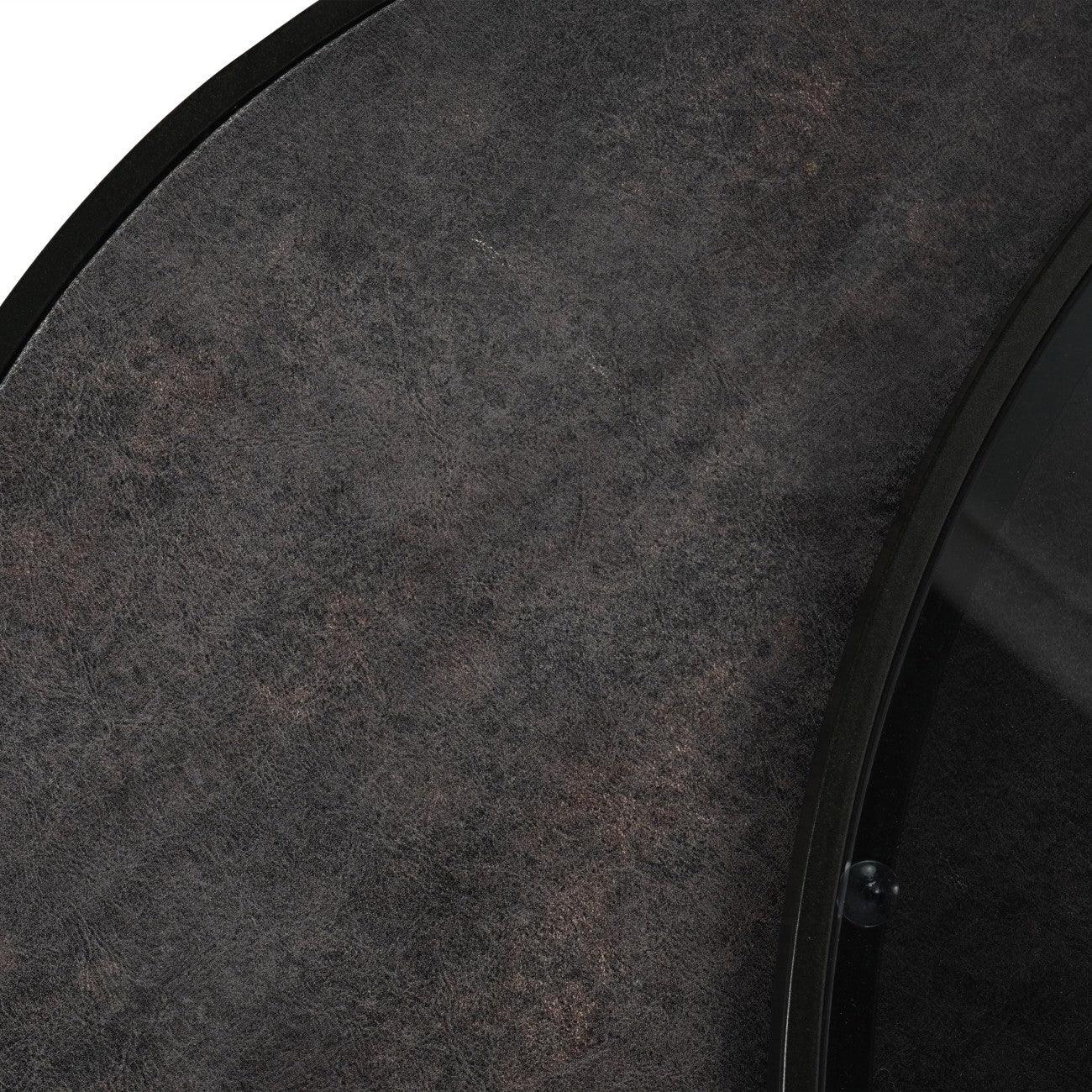 Dark textured tabletop with subtle pattern detail and smooth edge.