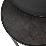 Dark textured surface of round nesting table with sleek black edge.