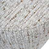 Natural slub fabric with textured weave detail on chair surface.