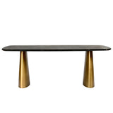 Black marble dining table with brass cone-shaped legs.