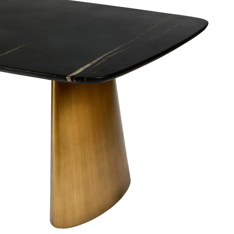Black marble table corner with brass leg detail.