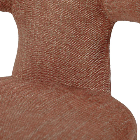 Brown upholstered chair showing textured fabric detail.