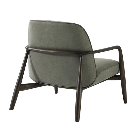 Green fabric chair with curved wooden arms, rear view.