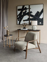 Green fabric chair with wooden arms in modern living room setting.