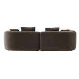 Back view of a brown velvet sofa with plush cushions.