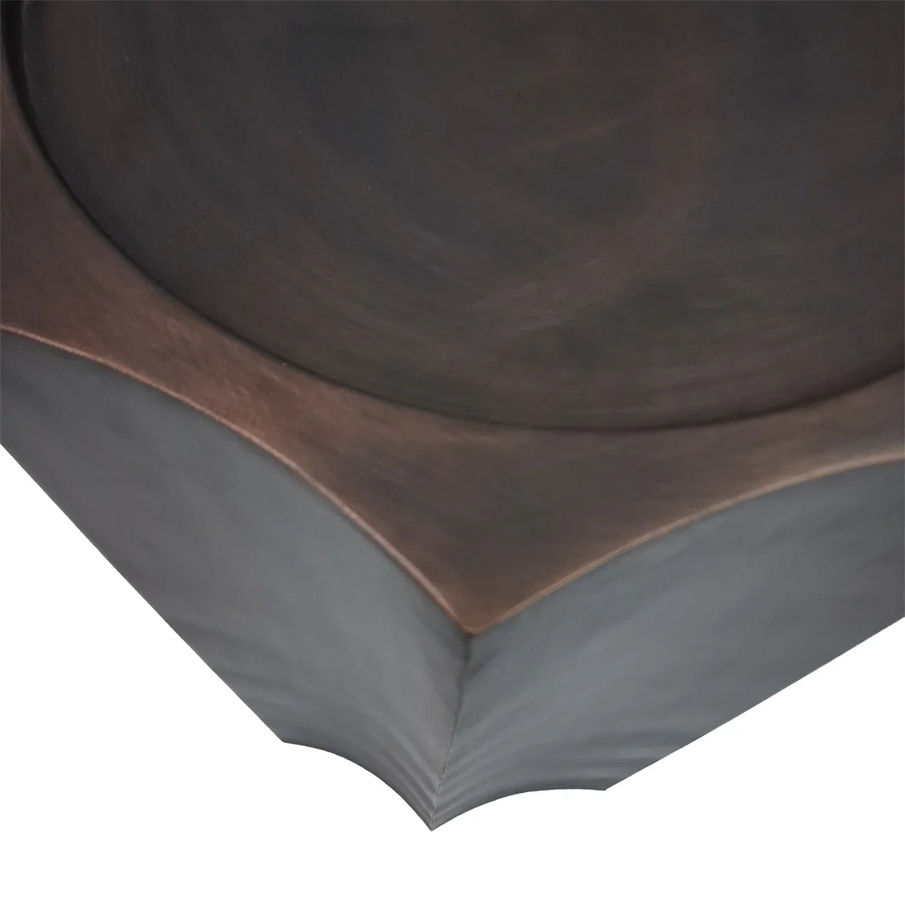 Antique bronze plinth corner with smooth, curved edges and subtle texture.