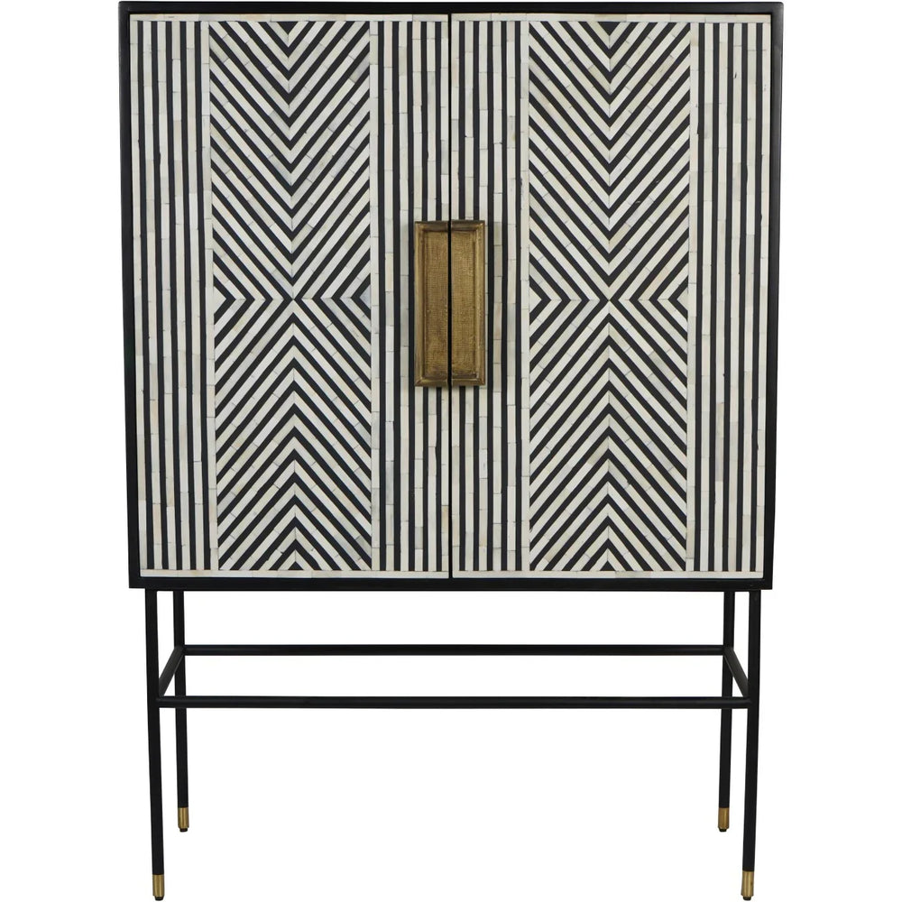 Black and white geometric inlay cabinet with brass handles and slender black legs.