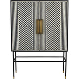 Black and white geometric inlay cabinet with brass handles and slender black legs.