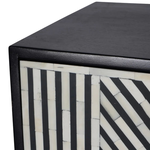 Black and white geometric pattern on cabinet corner detail.