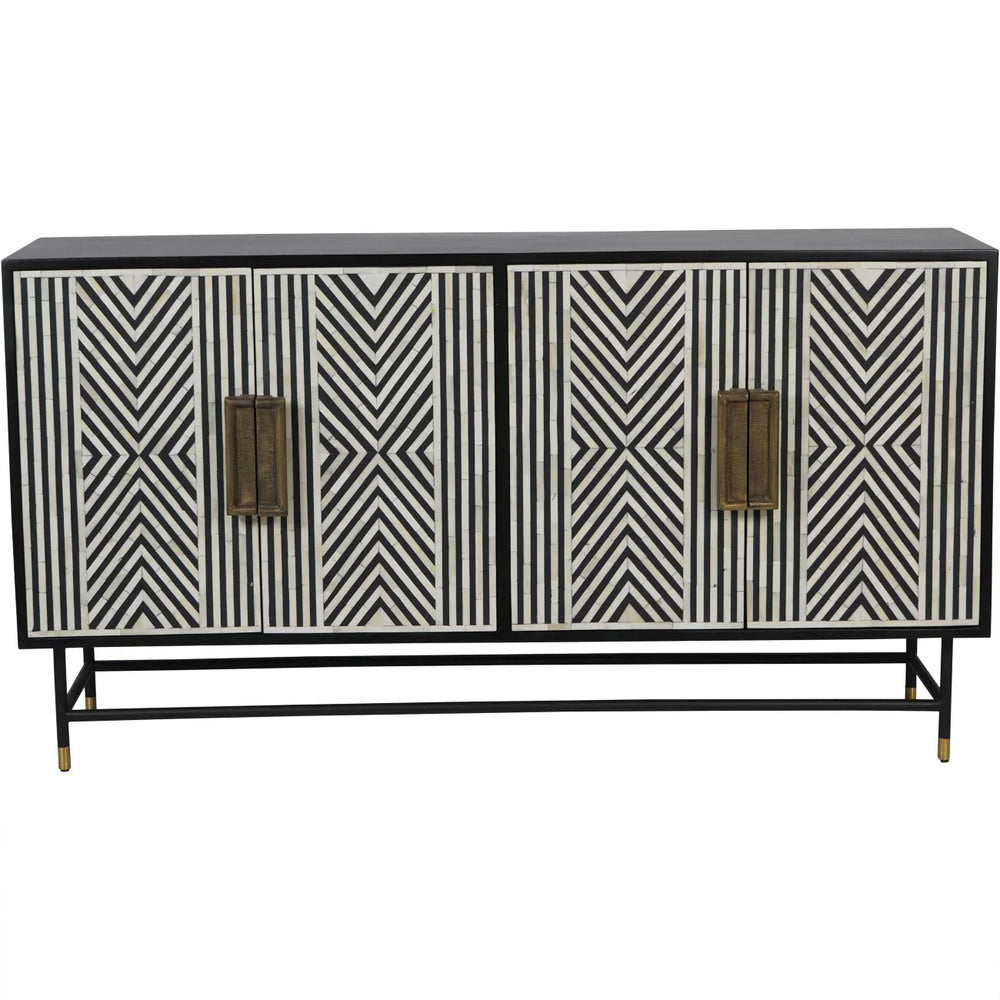 Black and white geometric patterned cabinet with brass handles.
