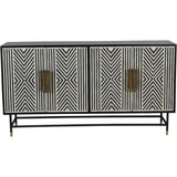 Black and white geometric patterned cabinet with brass handles.