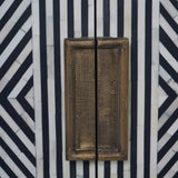 Black and white geometric pattern with textured brass handles