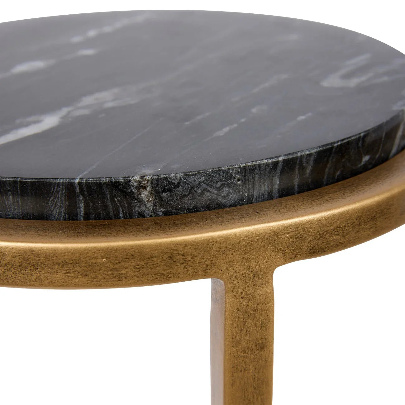 Black marble tabletop with aged gold frame detail.