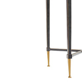 Dark metal table legs with gold-toned feet detail.