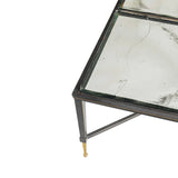 Glass tabletop with sleek metal frame and gold-tipped legs.