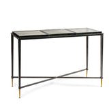 Black metal console table with glass top and gold-tipped legs.
