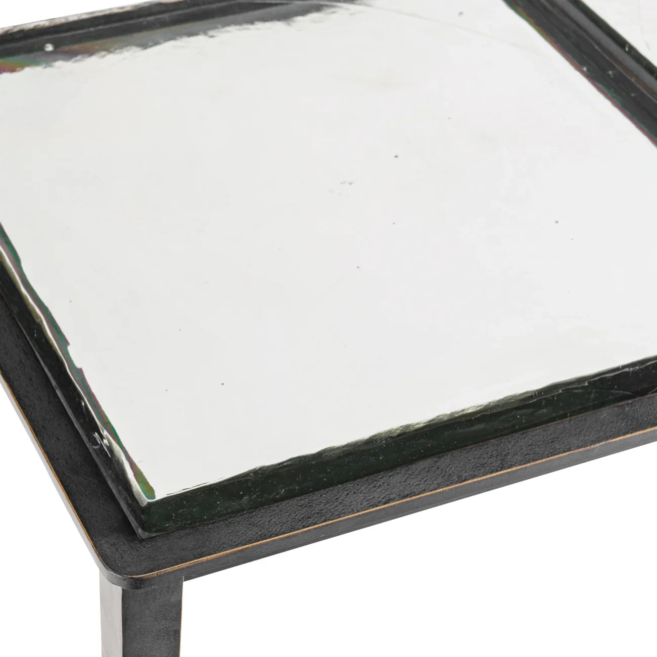 Clear glass tabletop with black metal edge detail.