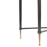 Black metal table legs with gold-tipped feet detail.