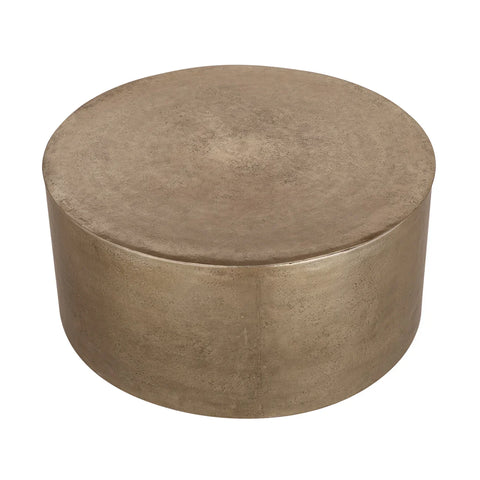 Bronze round metal coffee table with a smooth, textured surface.